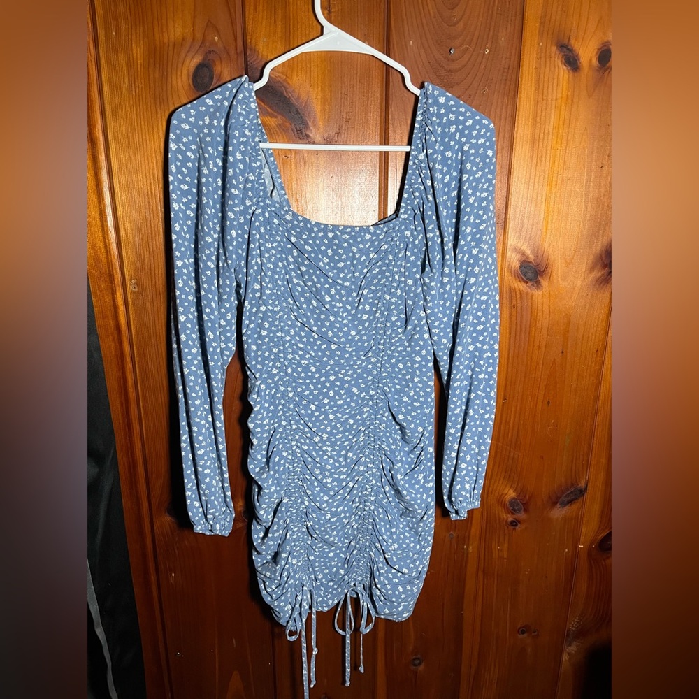 This blue flower dress has never been worn! And is a medium from wild fable.